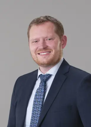 A headshot photo of Councillor Damian Penner